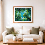 Finished sunlight filtering through green canopy cross stitch artwork displayed as home decor