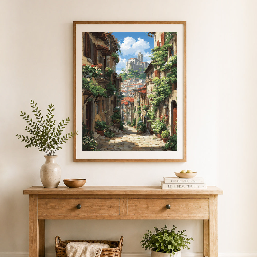 Finished sunlit italian hill town cross stitch artwork displayed as home decor