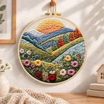 Sunlit mountain wildflowers embroidery hoop wall art displayed as warm and cozy handmade home decor