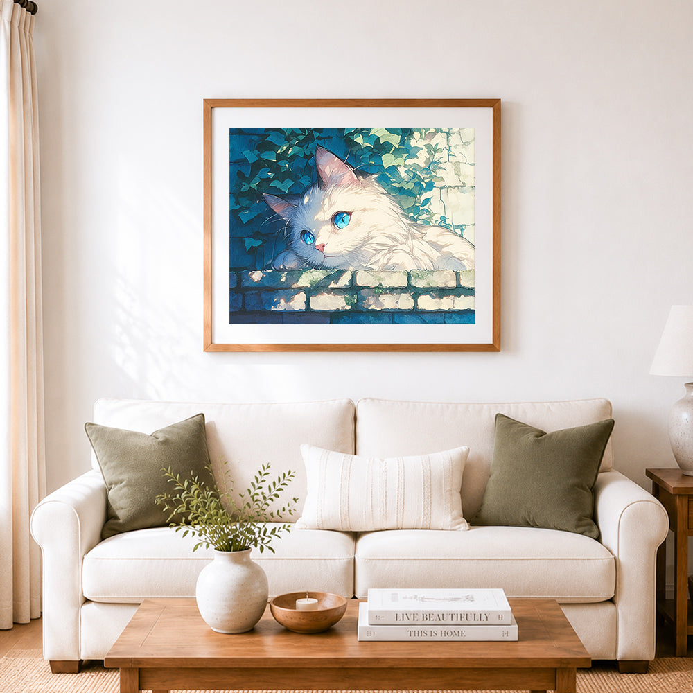 Finished sunlit white cat cross stitch artwork displayed as home decor