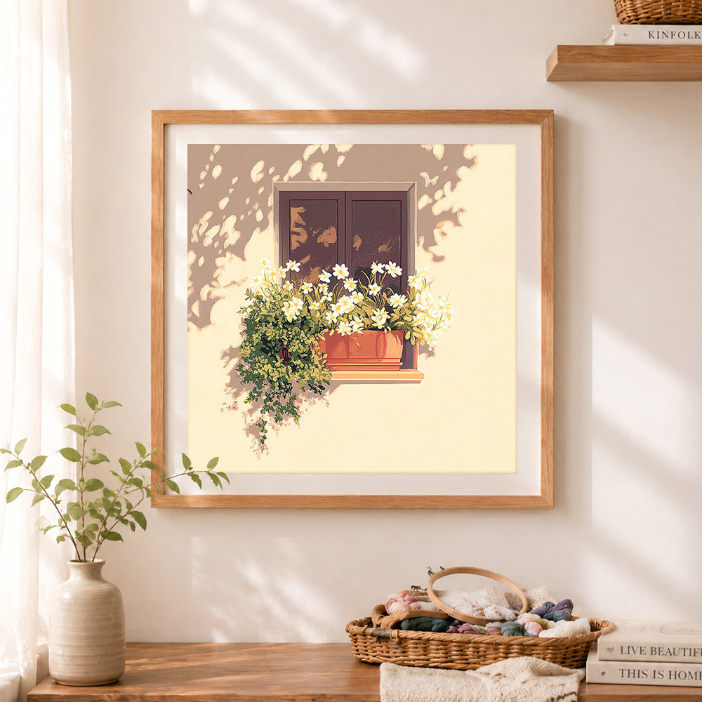 Finished sunlit window box with white flowers cross stitch artwork displayed as home decor