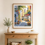 Finished sunny alley with flower shop cross stitch artwork displayed as home decor