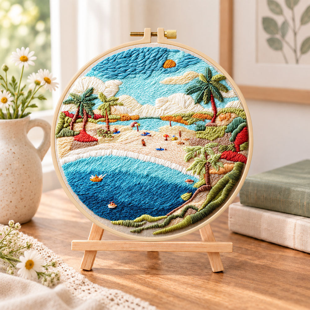 Sunny beach bay embroidery kit finished hoop displayed on a wooden stand as cozy tabletop decor