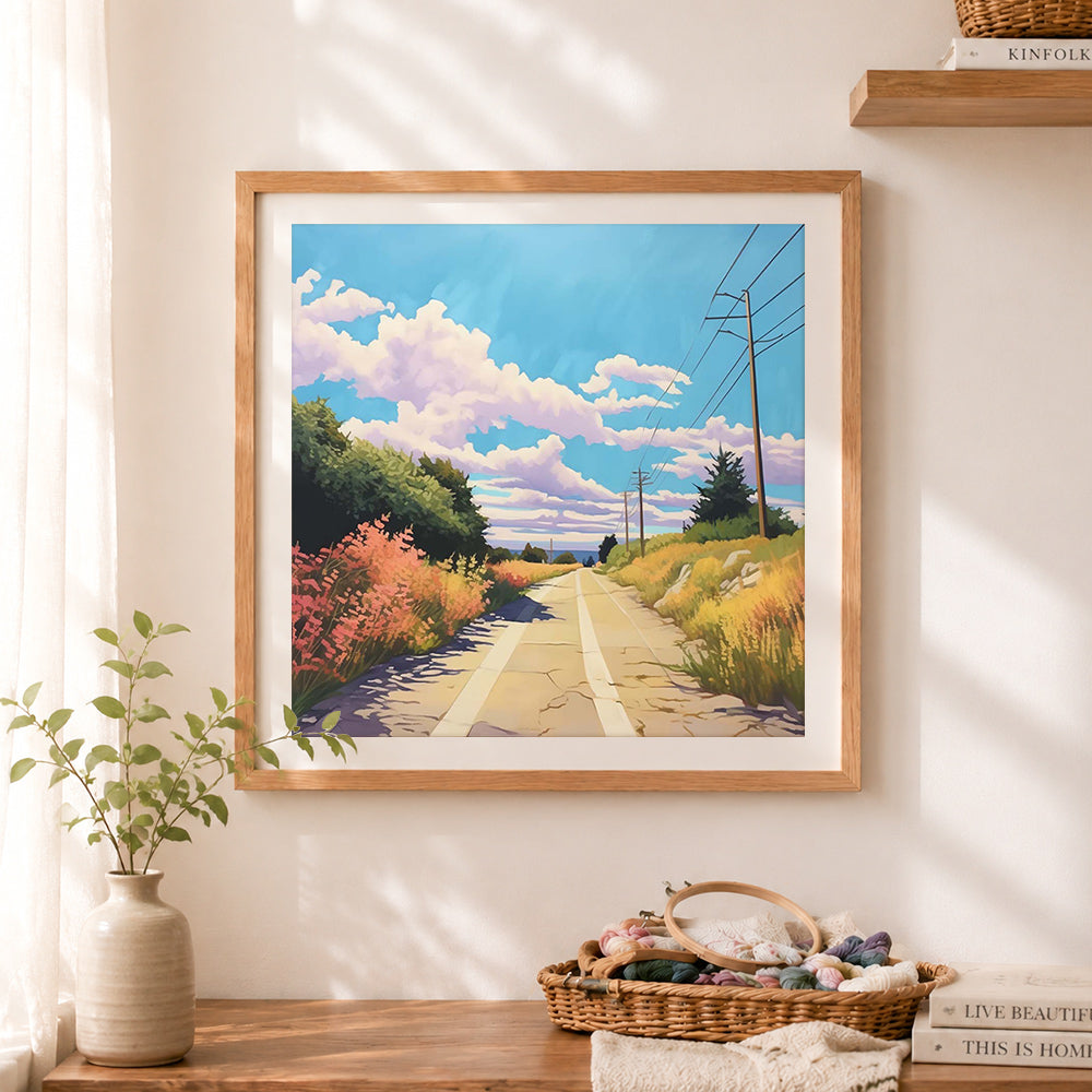 Finished sunny country road scenery cross stitch artwork displayed as home decor