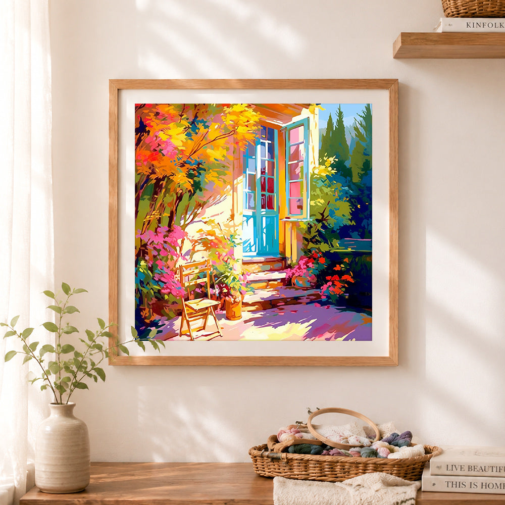 Finished sunny french cottage garden patio cross stitch artwork displayed as home decor