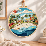 Sunny tropical beach embroidery hoop wall art displayed as warm and cozy handmade home decor
