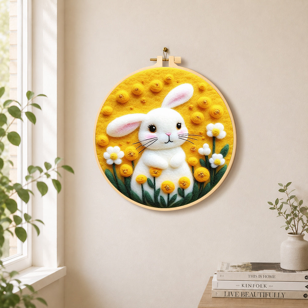 Sunny white bunny and yellow flowers needle felt wall art displayed in a bright home interior