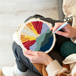 Creating handmade sunrise mountain landscape punch needle artwork