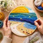 Creating the sunset beach and blue rolling waves wool painting by hand with a felting needle