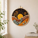 Sunset in the desert needle felt wall art displayed in a bright home interior