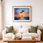 Finished sunset love balloons cross stitch artwork displayed as home decor