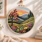Sunset mountain bloom embroidery hoop wall art displayed as warm and cozy handmade home decor