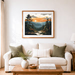 Finished sunset over pine forest and rolling mountains cross stitch artwork displayed as home decor