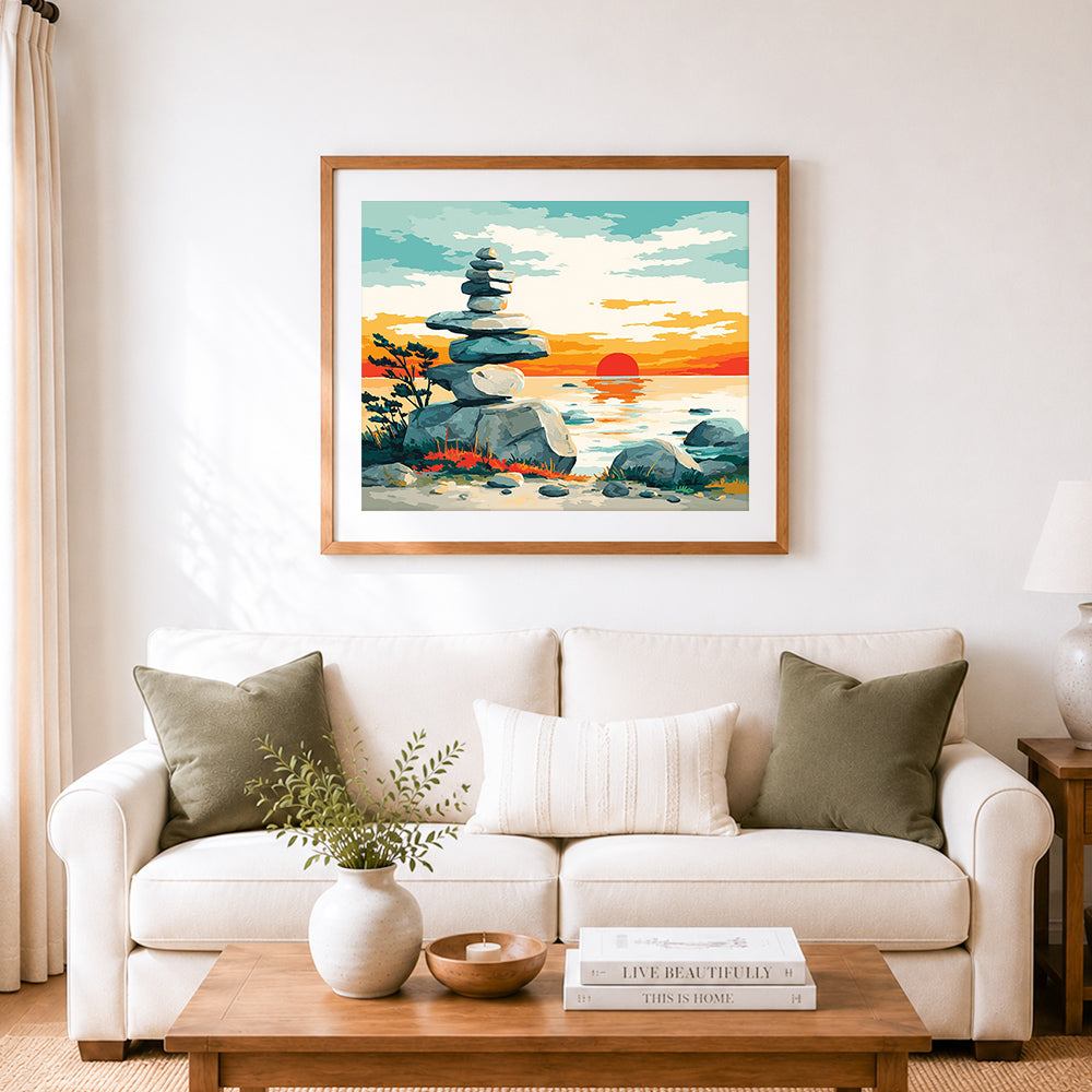Finished sunset stacked shore stones cross stitch artwork displayed as home decor