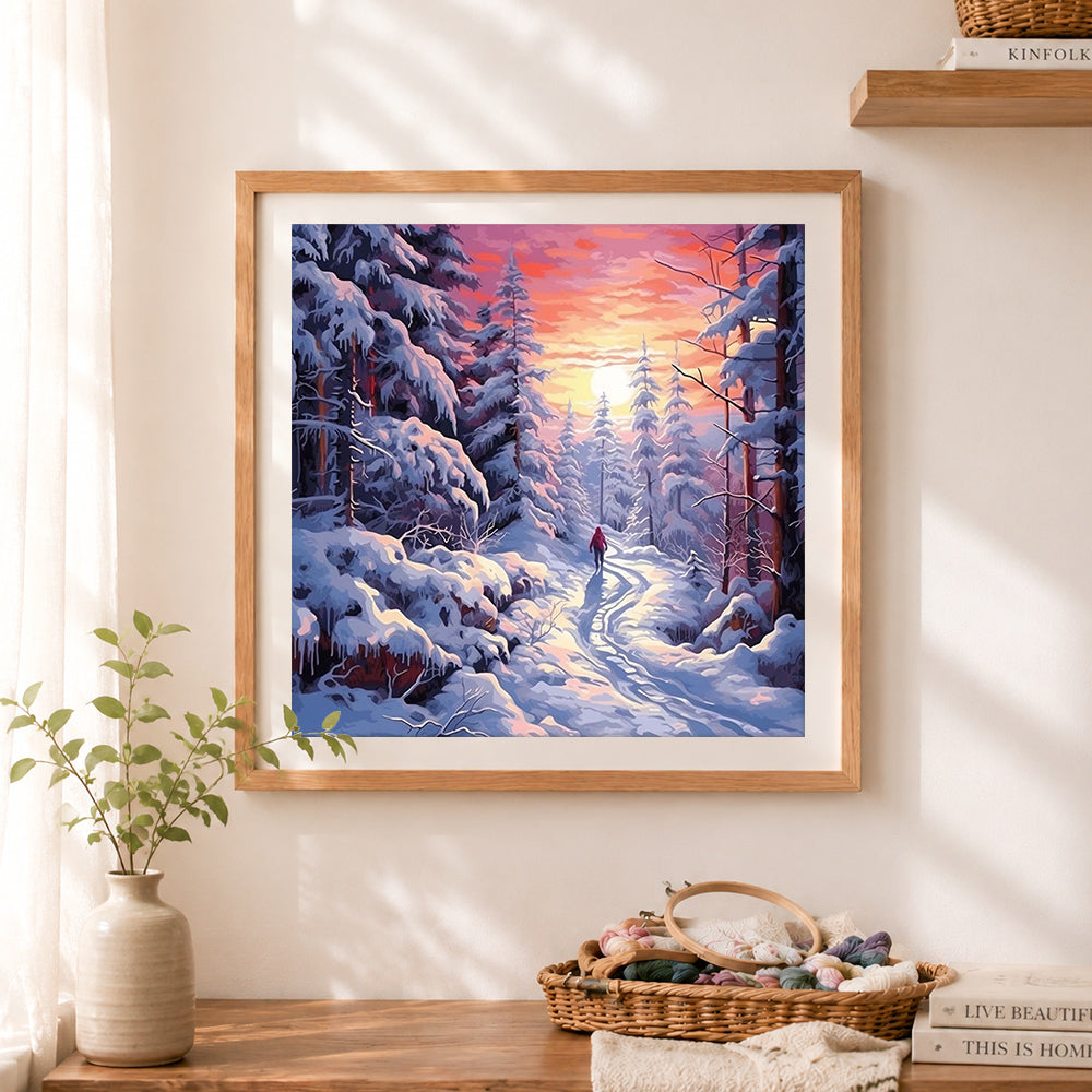 Finished sunset winter forest hiking path cross stitch artwork displayed as home decor