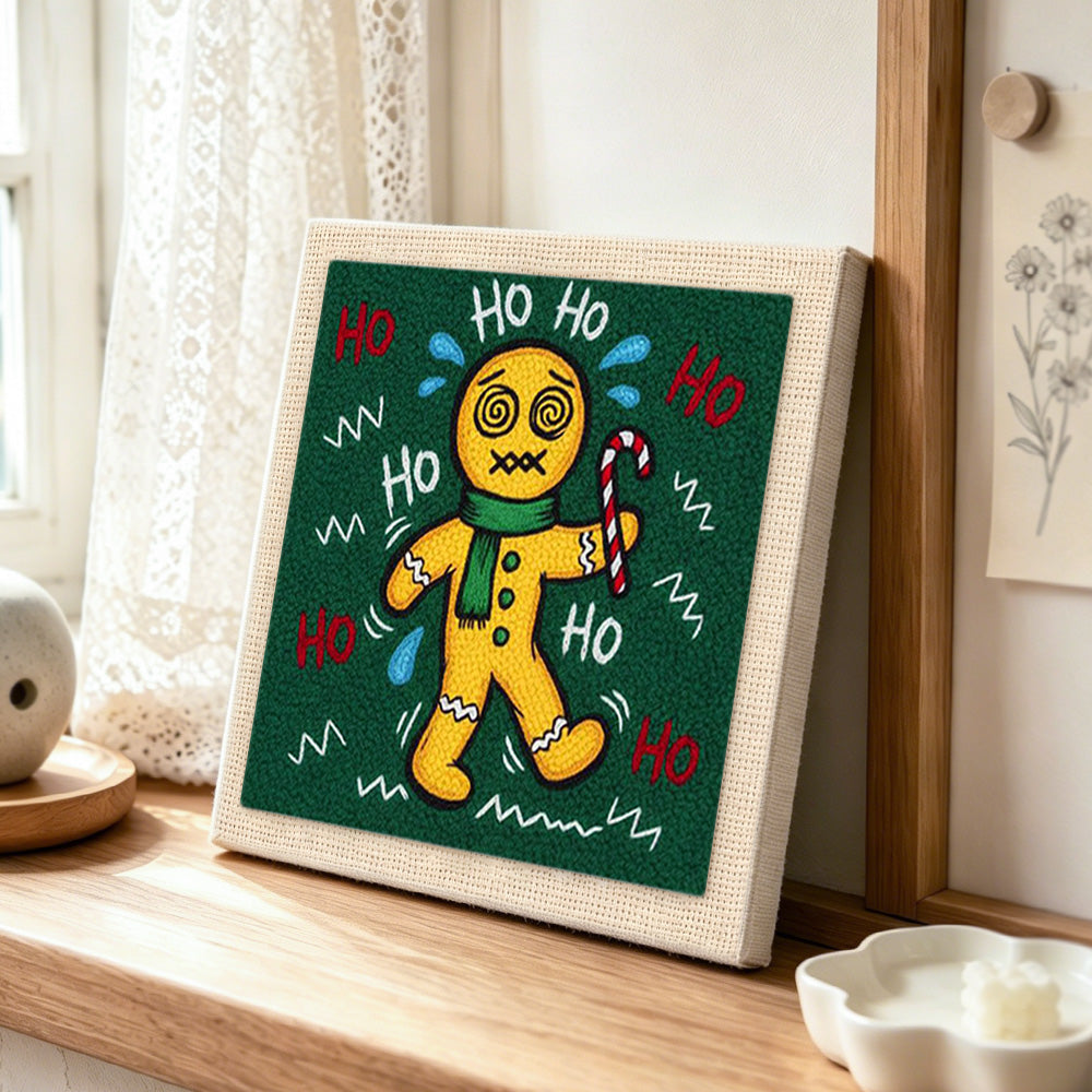 Sweating dizzy gingerbread man punch needle artwork displayed on a table