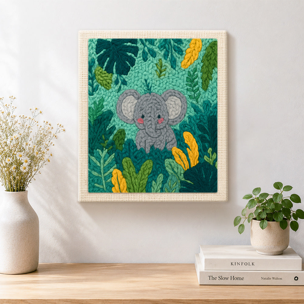 Finished sweet baby elephant in tropical leaves artwork displayed on a wall