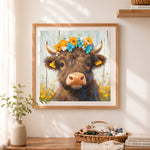 Finished sweet brown highland cow and wildflowers cross stitch artwork displayed as home decor