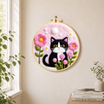 Sweet cat with pink flowers needle felt wall art displayed in a bright home interior