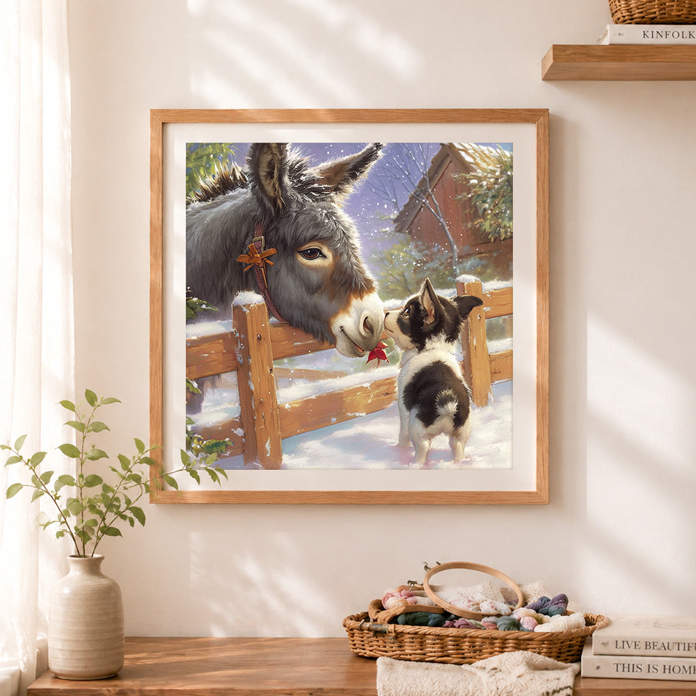 Finished sweet donkey and puppy in winter snow cross stitch artwork displayed as home decor
