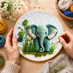 Creating the sweet mint green elephant and plants wool painting by hand with a felting needle