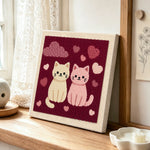 Sweet pink and cream cat couple punch needle artwork displayed on a table