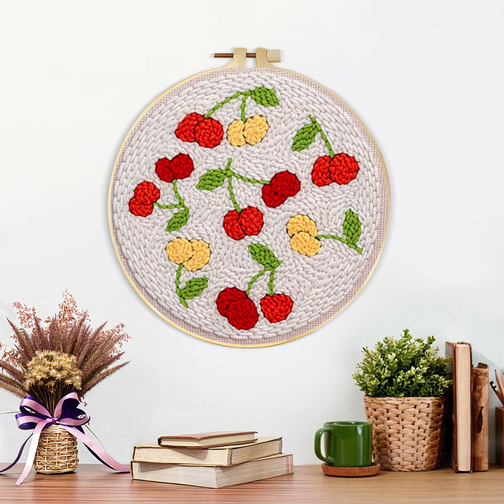 Finished sweet red and yellow cherries artwork displayed on a wall