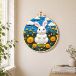 Sweet white bunny among yellow flowers needle felt wall art displayed in a bright home interior