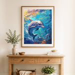 Finished swimming dolphins cross stitch artwork displayed as home decor