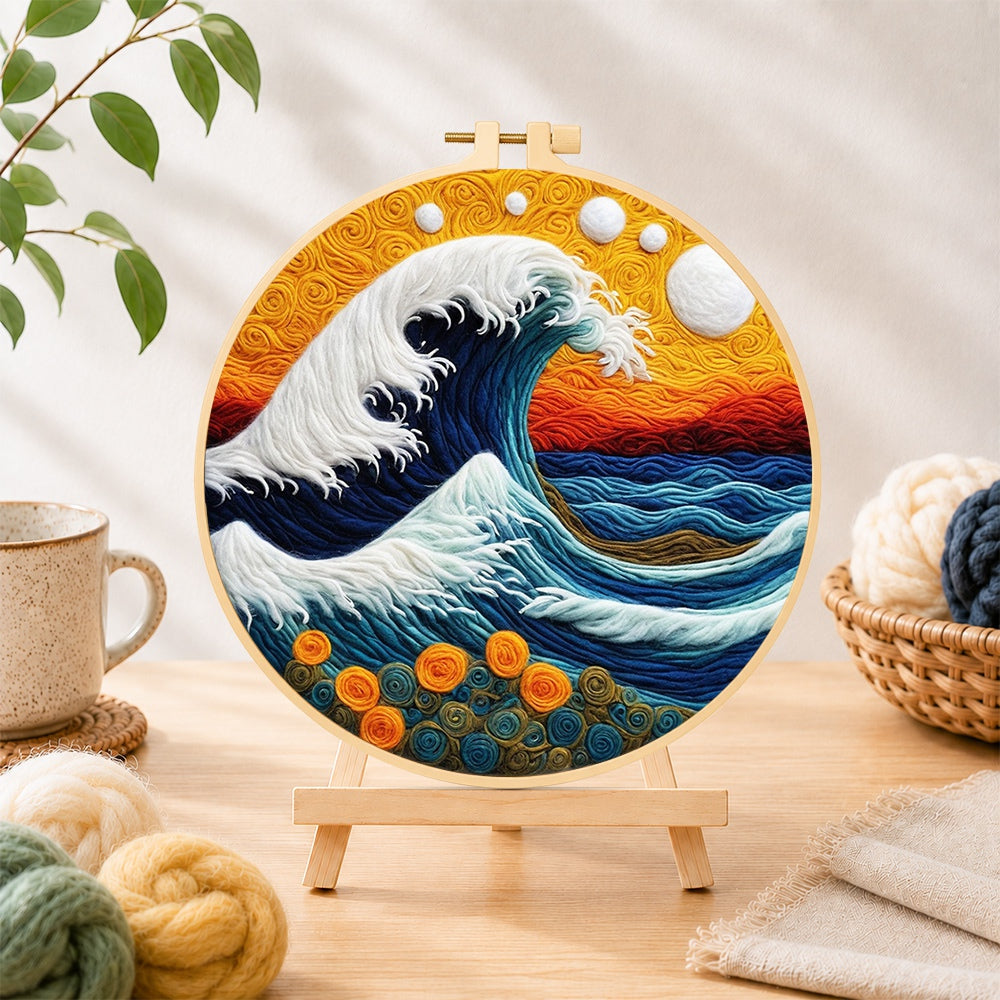Finished swirling ocean and sunset needle felting displayed on a wooden easel