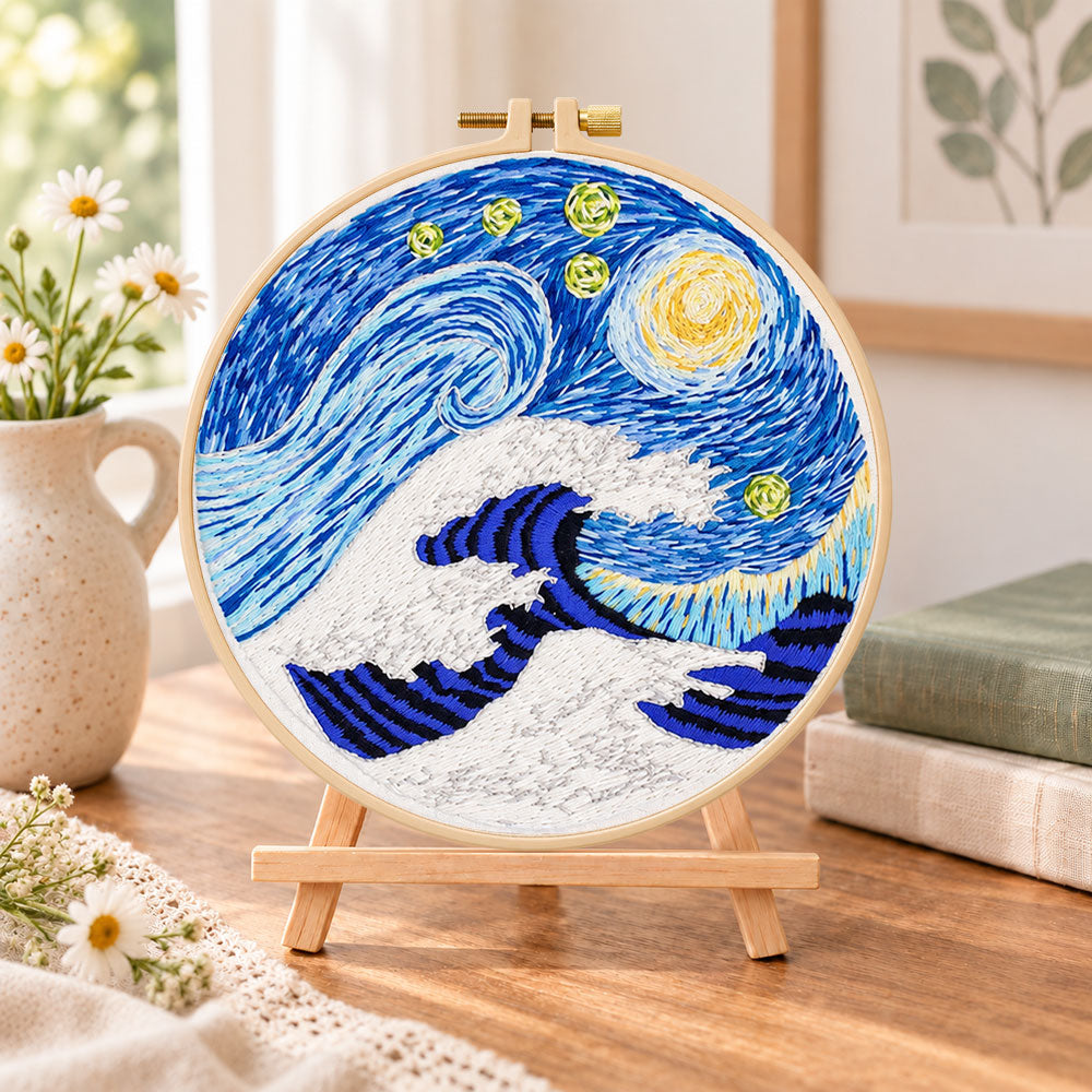 Swirling ocean waves embroidery kit finished hoop displayed on a wooden stand as cozy tabletop decor