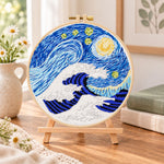 Swirling ocean waves embroidery kit finished hoop displayed on a wooden stand as cozy tabletop decor