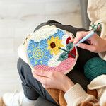 Creating handmade swirly sun and cheerful sunflower punch needle artwork