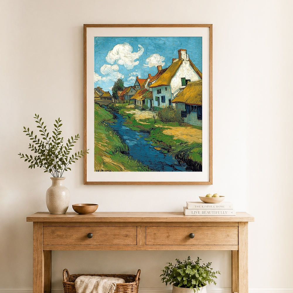 Finished thatched roof village by blue stream cross stitch artwork displayed as home decor