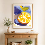 Finished thick brushstroke lemon slice cross stitch artwork displayed as home decor