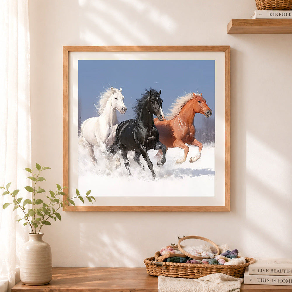 Finished three galloping horses in snow cross stitch artwork displayed as home decor