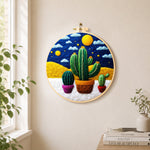Three potted cactus under the starry night needle felt wall art displayed in a bright home interior