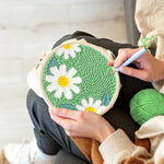Creating handmade three pure white daisies punch needle artwork