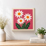 Finished three simple daisy flowers artwork displayed on a wall