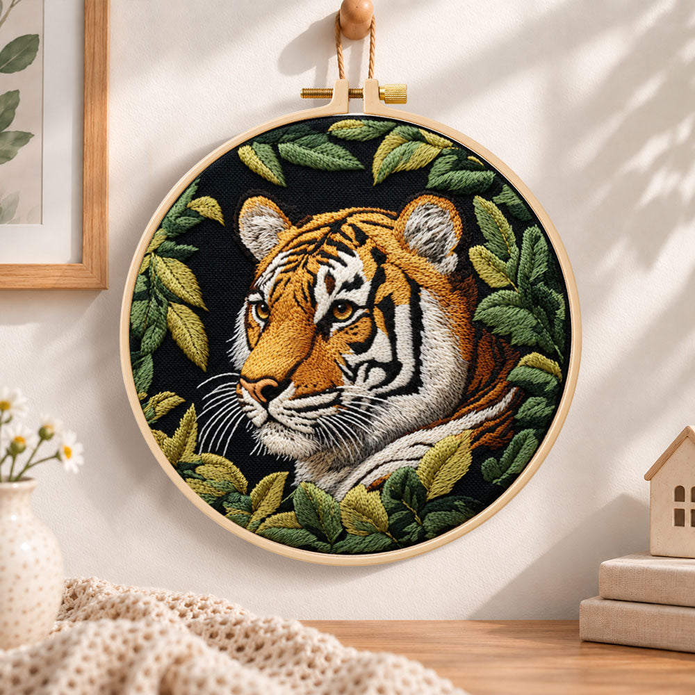 Tiger among green leaves embroidery hoop wall art displayed as warm and cozy handmade home decor