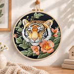 Tiger and peach blossoms embroidery hoop wall art displayed as warm and cozy handmade home decor