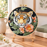 Tiger and peach blossoms embroidery kit finished hoop displayed on a wooden stand as cozy tabletop decor