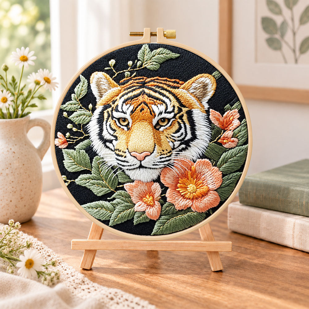 Tiger and peach blossoms embroidery kit finished hoop displayed on a wooden stand as cozy tabletop decor