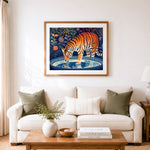 Finished tiger drinking at dusk cross stitch artwork displayed as home decor