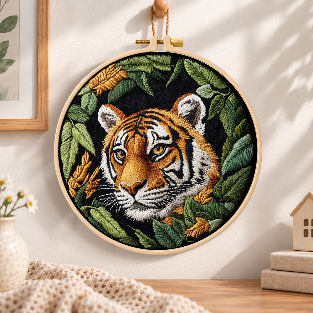 Tiger in dark foliage embroidery hoop wall art displayed as warm and cozy handmade home decor