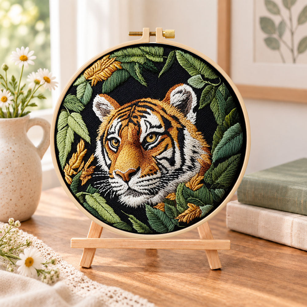 Tiger in dark foliage embroidery kit finished hoop displayed on a wooden stand as cozy tabletop decor