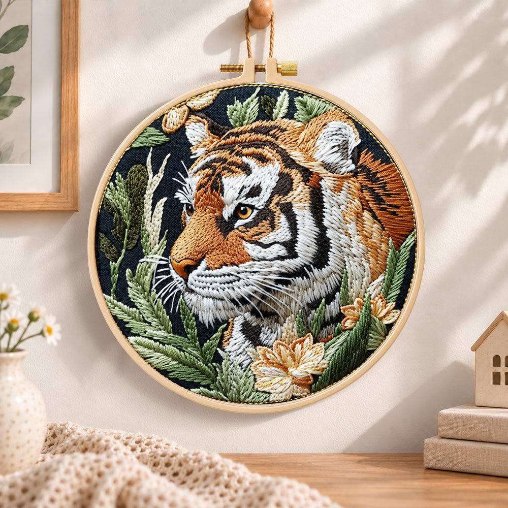 Tiger in jungle foliage embroidery hoop wall art displayed as warm and cozy handmade home decor