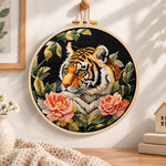 Tiger with pink peonies embroidery hoop wall art displayed as warm and cozy handmade home decor