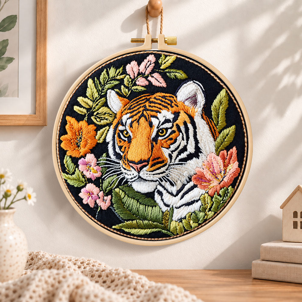 Tiger with wild blooms embroidery hoop wall art displayed as warm and cozy handmade home decor