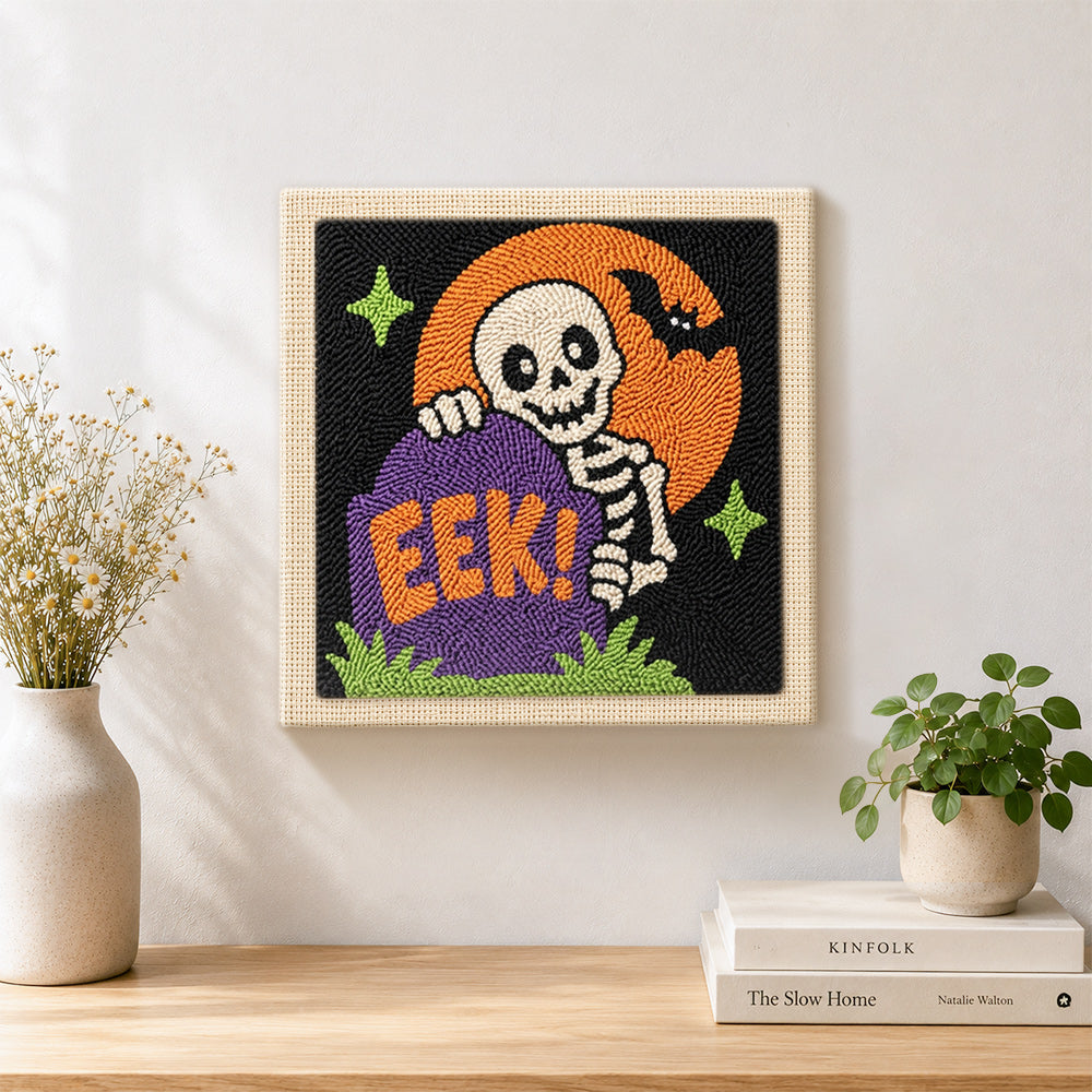 Finished tombstone skeleton artwork displayed on a wall